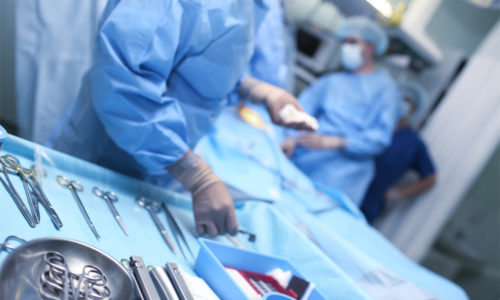 surgeon with instruments